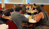 Laboratorians working together around a table