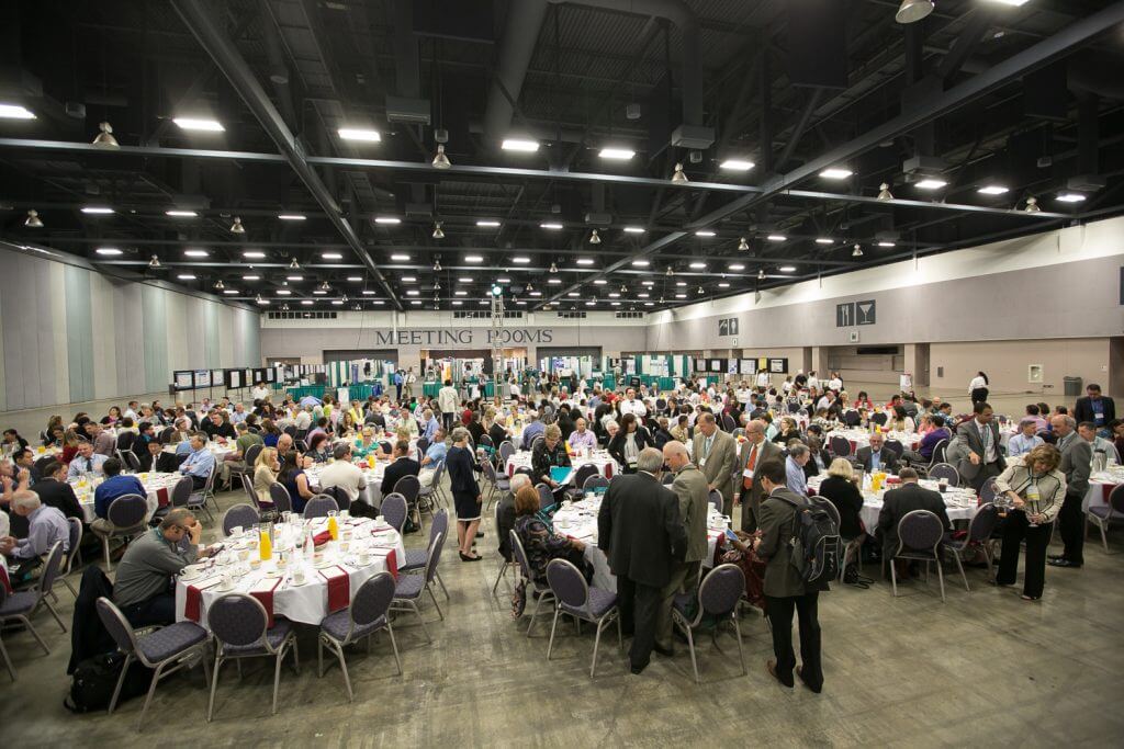 Meeting attendees enjoy breakfast in the exhibit hall