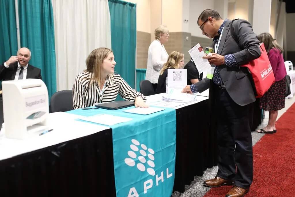 Attendees at the registration desk