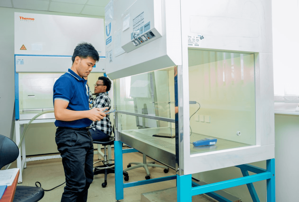 Field certifiers from Kenya and Cambodia take measurements during their NSF accreditation practical test.