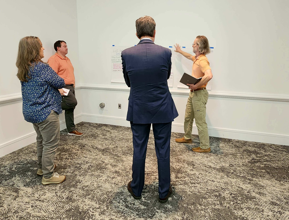 Members of Laboratory Leaders of Today Cohort 2 discuss in a small group at their in-person meeting prior to the 2024 APHL Annual Conference.