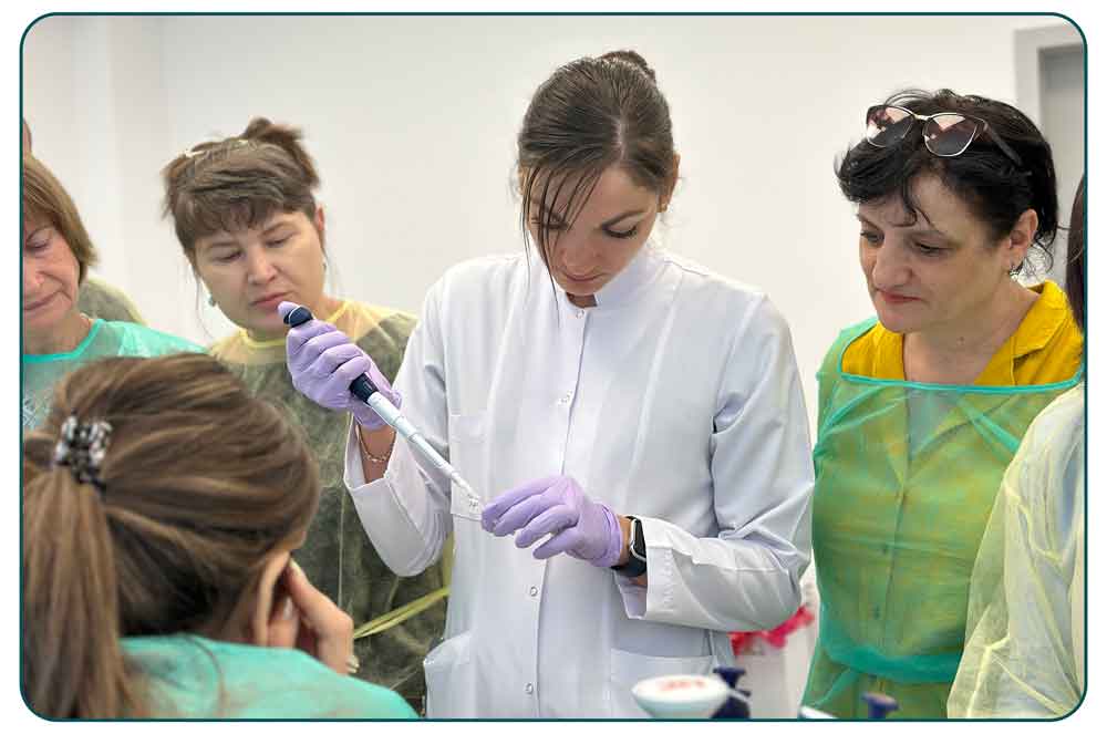 Svetlana Colac, of Moldova's National Agency for Public Health, demonstrates dilution of sequencing libraries during a PulseNet Eastern Europe Central Asia training workshop.