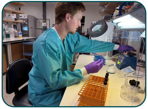 Davis Covington prepares a McFarland suspension for the modified carbapenem inactivation method (mCIM). Photo: LDH Bureau of Laboratory Services.