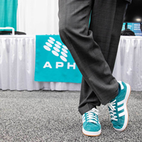 APHL President Scott Shone's on-brand shoes at APHL 2026.
